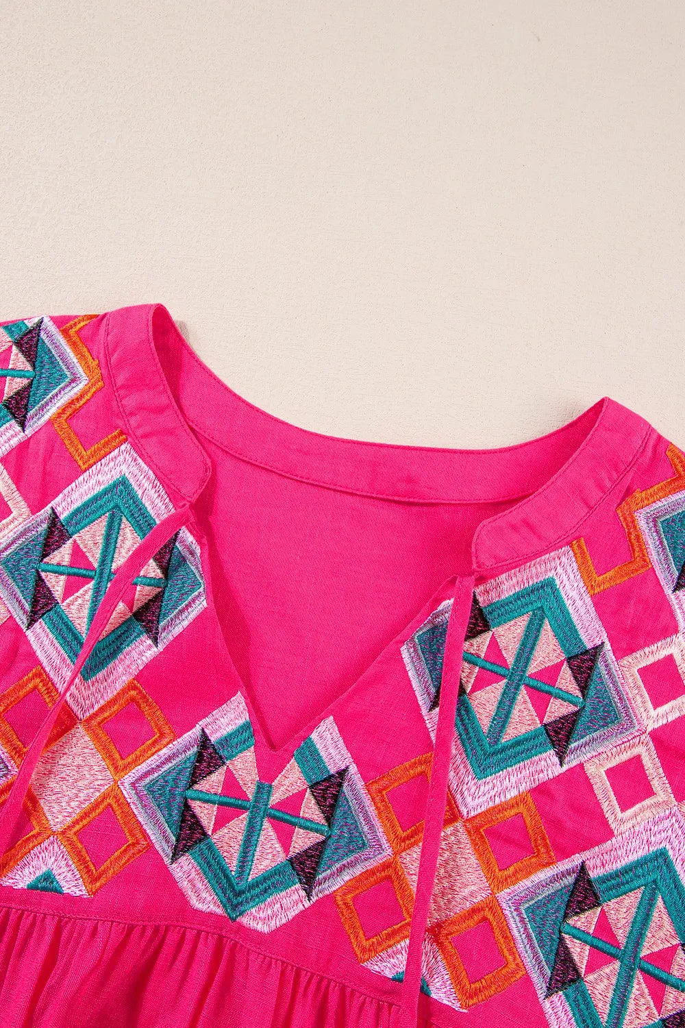 Geometric Embroidered Tassel Tie Neck Blouse -